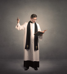young priest in giving his blessing