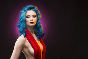 Portrait of beautiful dyed blue colour hair topless naked shoulders girl wearing red scarf on...
