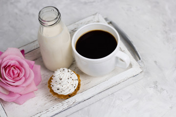 top view cupcake milk bottle coffe cup rose flower vintage wooden tray concrete background