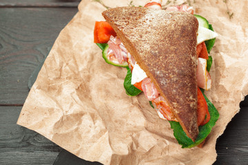 sandwich on a wooden table