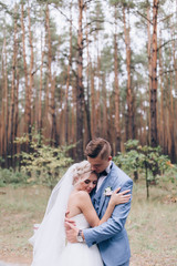 Walking newlyweds in nature.