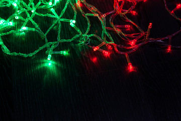 Colorful light Christmas on wood background.