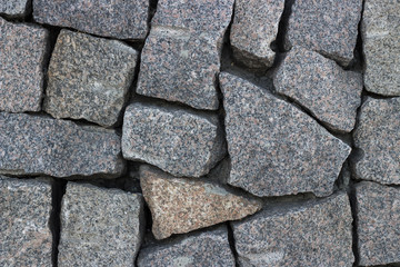 Gray granite stones. Granite wall, texture, background.