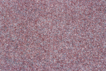 Red granite, texture, background. Close-up