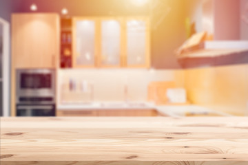 Wooden table with blur kitchen background