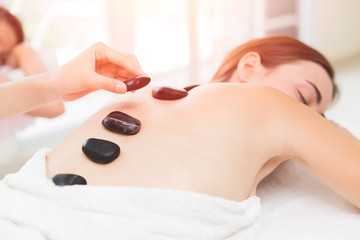 Hot and Cold Stones Massage in Spa for Back Pain Relief and Relaxation