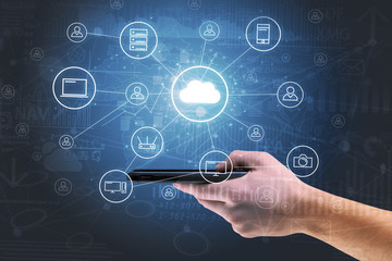 Businessman working on phone with reports and graphs concept around
