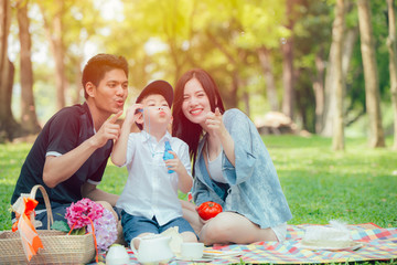Asian teen family happy holiday picnic moment in the park
