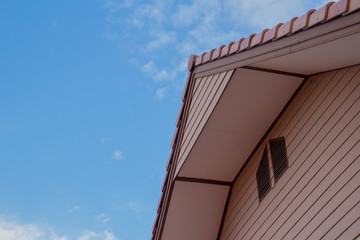 The house gable with the clear blue sky