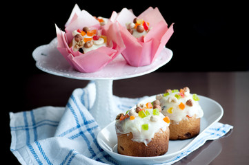 Easter bread with white icing, candied fruits and nuts