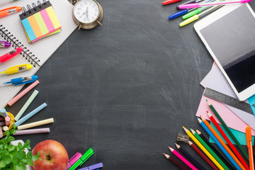 On the school board, school supplies. With an empty place for inscription or advertising.