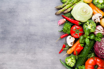 Flat lay of various colorful raw vegetables.