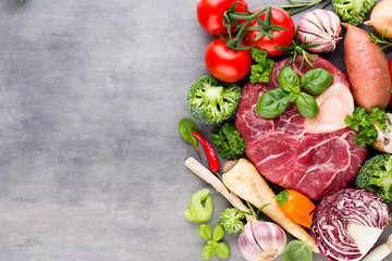 Raw fresh meat Ribeye Steak with vegetables and spice.