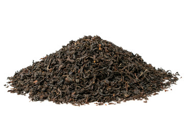 Bunch of dry black tea leaves on a white, close up.