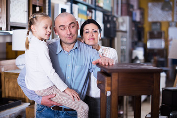 Naklejka premium Family is choosing new furniture