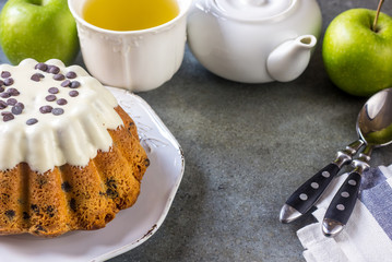 Glazed fresh cake on a round wooden stand