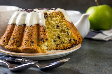 Glazed fresh cake on a round wooden stand