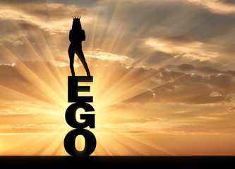 Silhouette of a narcissistic and selfish woman with a crown on her head standing on the word ego