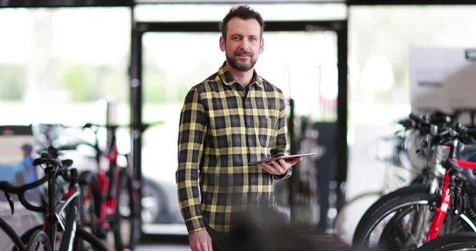 Portrait of a small business owner in a cycle store