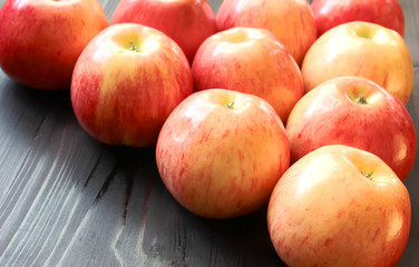 Ripe red apples on table close up