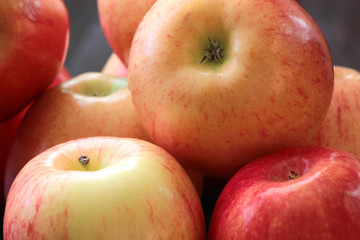 Ripe red apples on table close up