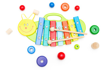 Wooden xylophone and other wooden toys on a white background. Education concept