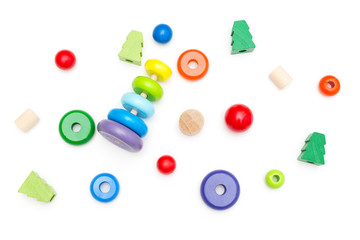 Fototapeta premium Wooden Pyramid and other wooden toys on a white background. Education concept