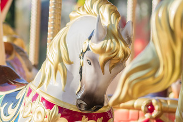 Closeup of a carousel horse head in sunlight