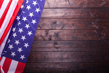 The American Flag Laying on a Wooden Background