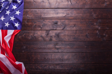The American Flag Laying on a Wooden Background