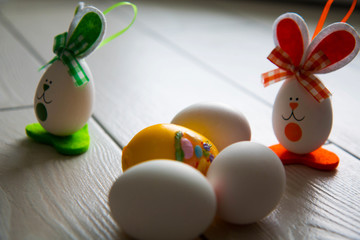 Easter eggs on wooden background. Happy Easter. Creative photo with easter eggs