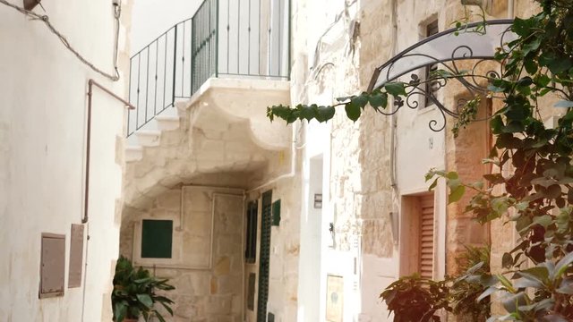 Inside old town of Polignano a Mare, in Puglia region, Italy, along the suggestive narrow streets of the famous italian village by the sea