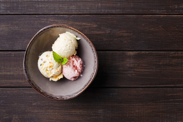 Assorted ice cream scoops in bowl top view