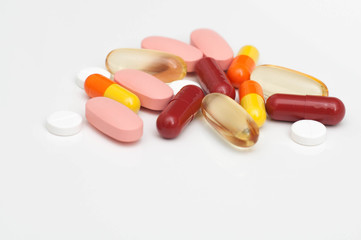 Colorful medical pills, tablets, capsules on the white backgroung.