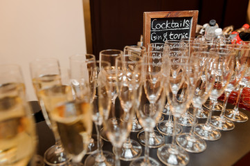 Set of elegant glasses filled with tasty champagne