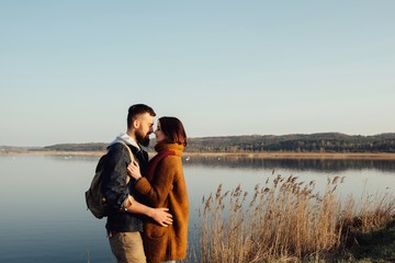 Young tourist couple at sunset sun