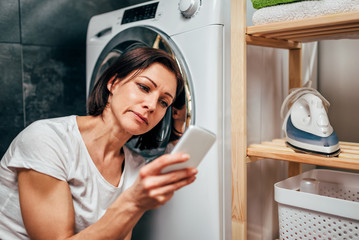 Woman calling for appliance repair service