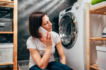 Woman calling for appliance repair service