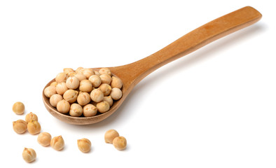 dried chickpeas in the wooden spoon, isolated on white