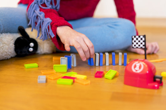 Girl 8 Years Old Is Played In The Room With Toys.