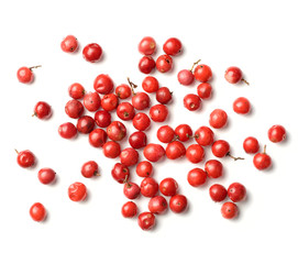 dried pink peppercorns isolated on white, top view