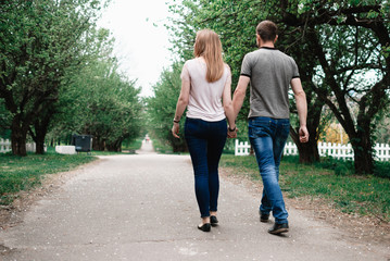 Young beautiful couple walking outdoor