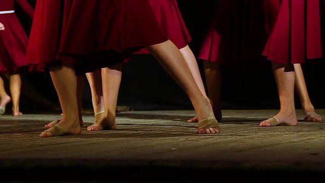 Closeup of teenage female legs of dancers on stage. Slow motion hd video footage