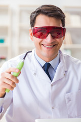 Naklejka premium Young dentist working in the dentistry hospital