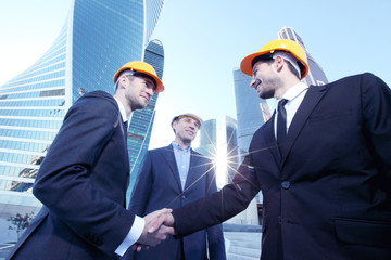 Investor and contractor shaking hands