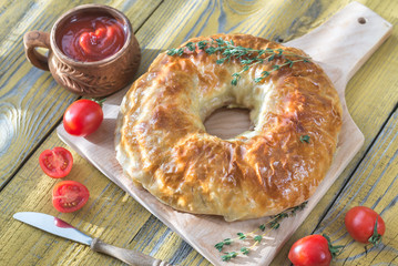 Meatball Wellington ring with tomato sauce