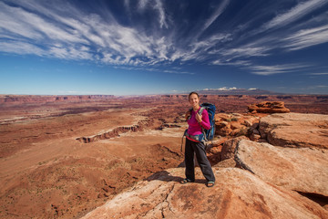 Fototapeta premium Hiker rests in Canyonlands National park in Utah, USA
