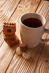tee and cookies on a wooden table