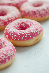 Obraz na płótnie Canvas Donut. Sweet icing sugar food. Dessert colorful snack. Glazed sprinkles. Treat from delicious pastry breakfast. Bakery cake. Doughnut with frosting. Baked unhealthy round. Top view
