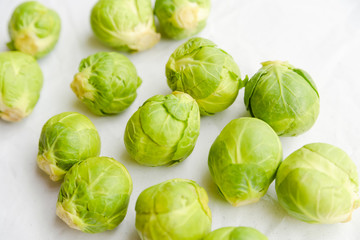 a pile of Brussels sprouts on a white background